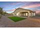 Spacious backyard with a small artificial grass area, perfect for outdoor entertaining and relaxation at 21759 E Estrella Rd, Queen Creek, AZ 85142