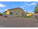 Home featuring a spacious backyard with rock landscaping and a small patch of grass at 21759 E Estrella Rd, Queen Creek, AZ 85142