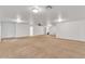 Expansive carpeted basement with recessed lighting, ceiling fan, and multiple doorways at 21759 E Estrella Rd, Queen Creek, AZ 85142