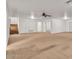 Vast carpeted basement featuring recessed lighting, ceiling fan, stairs and multiple doorways at 21759 E Estrella Rd, Queen Creek, AZ 85142