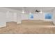Spacious carpeted basement with recessed lighting and good natural light from window at 21759 E Estrella Rd, Queen Creek, AZ 85142