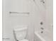Bathroom with a toilet, shower-tub combo, and tile surround at 21759 E Estrella Rd, Queen Creek, AZ 85142