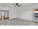 Well-lit bedroom with plush carpet, door to the patio, and ceiling fan at 21759 E Estrella Rd, Queen Creek, AZ 85142