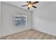 Bedroom with neutral carpet, ceiling fan, and a window for natural light at 21759 E Estrella Rd, Queen Creek, AZ 85142