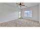 Bedroom with carpet, ceiling fan, natural light, and a glass door leading to the yard at 21759 E Estrella Rd, Queen Creek, AZ 85142
