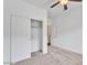 Bedroom with neutral carpet, closet with sliding doors, and a ceiling fan at 21759 E Estrella Rd, Queen Creek, AZ 85142