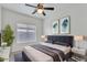 Stylish bedroom with modern decor, comfortable bed, and ample natural light at 21759 E Estrella Rd, Queen Creek, AZ 85142
