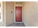 Inviting front door with a warm color and a welcoming doormat at 21759 E Estrella Rd, Queen Creek, AZ 85142