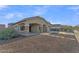 Lovely home exterior featuring a spacious front yard with desert landscaping and covered entryway at 21759 E Estrella Rd, Queen Creek, AZ 85142
