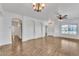 Spacious living room with hardwood floors, ceiling fan, and bright natural light at 21759 E Estrella Rd, Queen Creek, AZ 85142