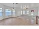 Bright living room featuring tile and carpet flooring with natural light from multiple windows at 21759 E Estrella Rd, Queen Creek, AZ 85142