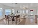 Bright, open-concept living and dining area with abundant natural light and stylish decor at 21759 E Estrella Rd, Queen Creek, AZ 85142