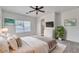 Serene main bedroom with soft lighting, neutral tones, and ensuite bathroom at 21759 E Estrella Rd, Queen Creek, AZ 85142