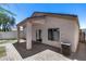 Backyard with a paved patio, covered awning, and stucco walls at 22225 N 29Th Dr, Phoenix, AZ 85027