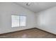 Bedroom with a window providing natural light and tile flooring throughout at 22225 N 29Th Dr, Phoenix, AZ 85027