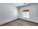 Bedroom features a window with blinds, neutral walls, and tile flooring at 22225 N 29Th Dr, Phoenix, AZ 85027