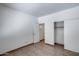 Bedroom features neutral colored wall paint, tile flooring, and a closet with sliding doors at 22225 N 29Th Dr, Phoenix, AZ 85027