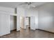 Bedroom with closet, tile flooring, and multiple doorways leading to other rooms at 22225 N 29Th Dr, Phoenix, AZ 85027