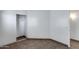 A bedroom with neutral colored wall paint, tile flooring, and a closet with sliding doors at 22225 N 29Th Dr, Phoenix, AZ 85027