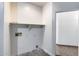 Functional laundry room featuring a shelf, and essential hookups for appliances ready for customization at 22225 N 29Th Dr, Phoenix, AZ 85027