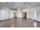 Open-concept living room showcasing neutral walls, tile flooring, and a view to kitchen at 22225 N 29Th Dr, Phoenix, AZ 85027