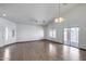 Bright and airy living room with tile floors, a ceiling fan, and sliding glass door to the backyard at 22225 N 29Th Dr, Phoenix, AZ 85027