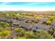 Aerial view of the neighborhood with mature landscaping, golf course, and mountain views at 22233 N 54Th Way, Phoenix, AZ 85054