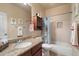 Bathroom features a vanity, granite countertops, and a shower-tub combo with playful decor at 22233 N 54Th Way, Phoenix, AZ 85054