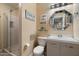 Bright bathroom with a glass-enclosed shower and a well-lit vanity area at 22233 N 54Th Way, Phoenix, AZ 85054