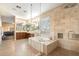 Luxurious bathroom boasts a soaking tub, glass shower, double vanity, and decorative tile accents at 22233 N 54Th Way, Phoenix, AZ 85054