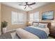 Comfortable bedroom featuring a cozy bed, neutral colors, and bright sunny windows at 22233 N 54Th Way, Phoenix, AZ 85054