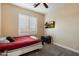 Inviting bedroom featuring a mounted TV, plantation shutters and neutral tones that offers a comfortable and modern space at 22233 N 54Th Way, Phoenix, AZ 85054