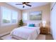 Bedroom showcasing neutral walls, white plantation shutters and a blue accent pillow on the bed at 22233 N 54Th Way, Phoenix, AZ 85054