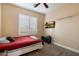 Bedroom with a bed, carpet flooring, tv mounted on the wall and plantation shutters at 22233 N 54Th Way, Phoenix, AZ 85054