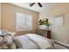 Cozy bedroom with plantation shutters, ceiling fan, and wall-mounted television at 22233 N 54Th Way, Phoenix, AZ 85054