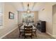 Elegant dining room with a stylish light fixture and window with shutters at 22233 N 54Th Way, Phoenix, AZ 85054