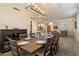 Dining room with an elegant light fixture, ample seating, and seamless flow to the inviting living room at 22233 N 54Th Way, Phoenix, AZ 85054