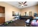Dedicated exercise room features a full set of weights, work out machines, mirrors, and storage cabinets at 22233 N 54Th Way, Phoenix, AZ 85054
