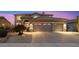 Charming two-story home featuring a three-car garage, desert landscaping and a lovely bougainvillea bush at 22233 N 54Th Way, Phoenix, AZ 85054