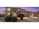 Beautiful home with a landscaped front yard, mature bushes, and a three-car garage at 22233 N 54Th Way, Phoenix, AZ 85054