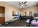 Well-equipped home gym featuring weights, exercise bench, mirror, and rubber flooring at 22233 N 54Th Way, Phoenix, AZ 85054