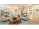 Inviting living room with a bright, open floor plan and elegant staircase leading to the upper level at 22233 N 54Th Way, Phoenix, AZ 85054