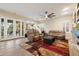 Spacious living area with plush couches, a decorative rug, and access to the patio at 22233 N 54Th Way, Phoenix, AZ 85054