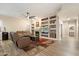 Cozy living room featuring a fireplace, built-in shelves, and comfortable seating at 22233 N 54Th Way, Phoenix, AZ 85054