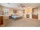 Large bedroom featuring a fireplace, ceiling fan, and a window with shutters at 22233 N 54Th Way, Phoenix, AZ 85054