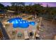 Aerial view of the private pool and spa with a fenced yard, patio seating and mature desert landscaping at 22233 N 54Th Way, Phoenix, AZ 85054