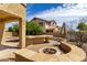 Outdoor patio with a built-in fire pit, perfect for entertaining and enjoying outdoor living at 2302 S Canfield --, Mesa, AZ 85209