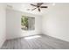 Bedroom features wood grain floors, recessed lighting, and window overlooking the backyard at 2302 S Canfield --, Mesa, AZ 85209
