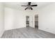 This spare bedroom features light gray wood grain floors and direct access to ensuite at 2302 S Canfield --, Mesa, AZ 85209
