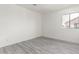 Bedroom features wood grain floors, a bright window, and plenty of wall space at 2302 S Canfield --, Mesa, AZ 85209